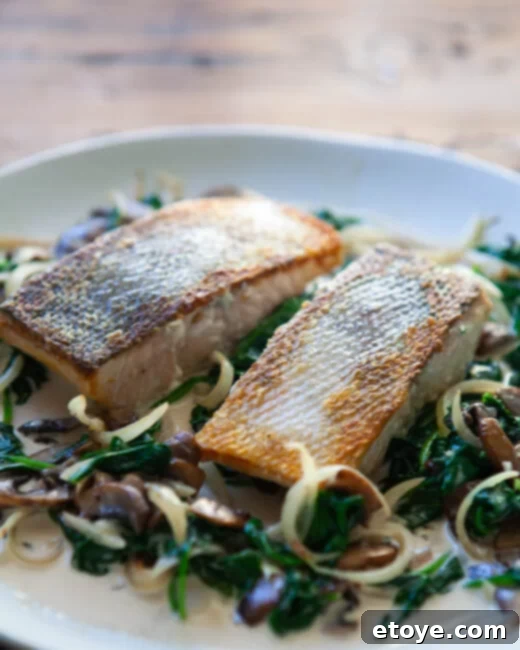 Pan-Seared Salmon with Creamy Spinach and Mushroom Sauce 1 featured 194073