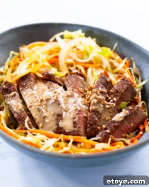 Flavorful Sesame Ginger Beef and Cabbage Noodle Bowls 1 featured 208563