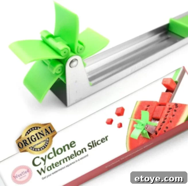 A hand demonstrating the use of a watermelon windmill cutter, creating perfect watermelon cubes effortlessly.