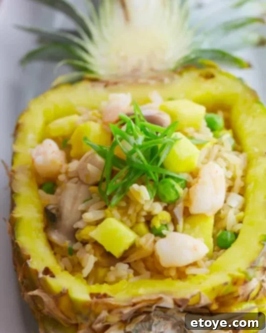Score a New Rice Cooker 4 Vibrant Pineapple Fried Rice served in a pineapple half