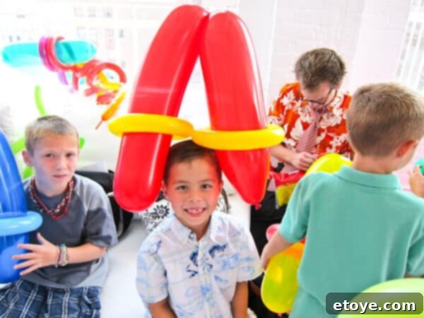 Child wearing a balloon hat resembling a hot dog