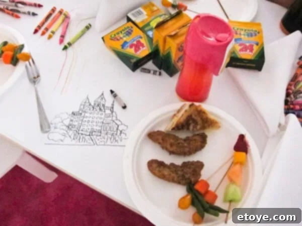 Another child's detailed drawing with a broken crayon