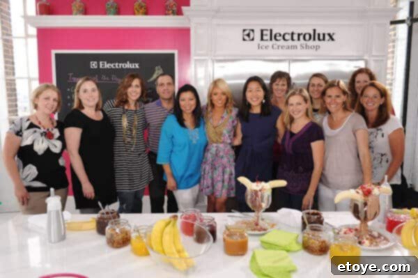 Woman standing next to a skinny woman in a group photo