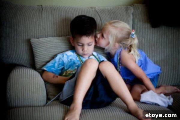 A moment of triumph and successful connection, as the children's interaction culminates in a positive and engaging outcome.