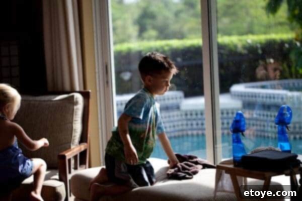 Encouraged by the girl's positive response, the boy human continues his task of washing windows with renewed vigor and focus.