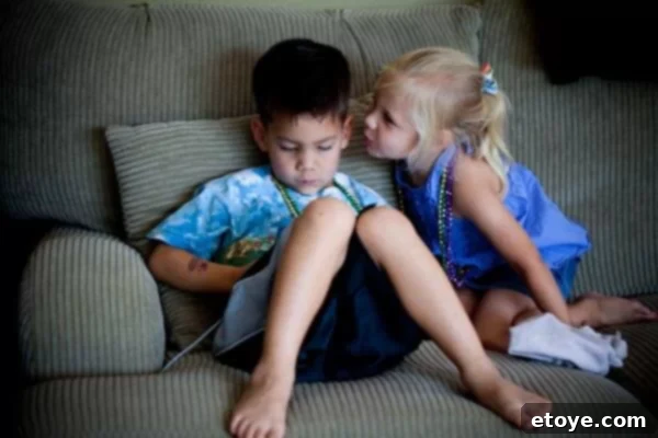 Anticipation builds as both children await the next development, demonstrating the subtle tension and timing in their interaction.