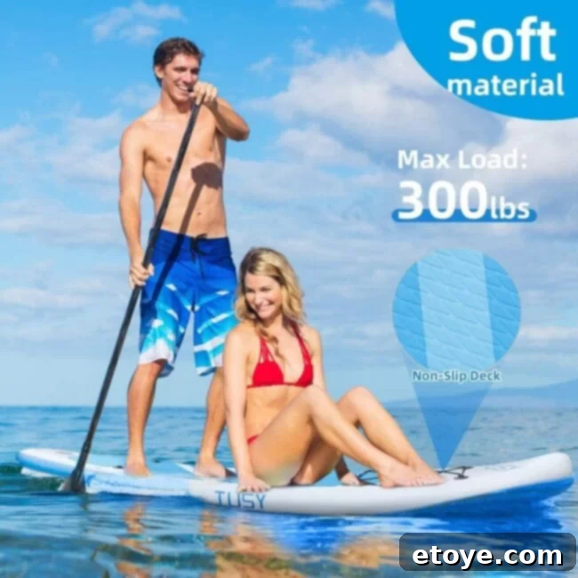 Epic Paddle Board Sweepstakes 3 Person standing confidently on an inflatable paddle board on a serene body of water, enjoying the view
