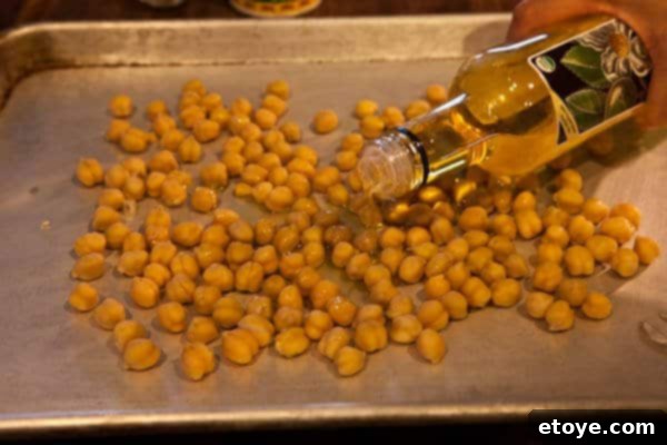 Dizzle the peas with Olive oil Crispy Roasted Chickpeas Recipe Drizzle Chickpeas with Olive Oil for Crispy Roasted Chickpeas Recipe