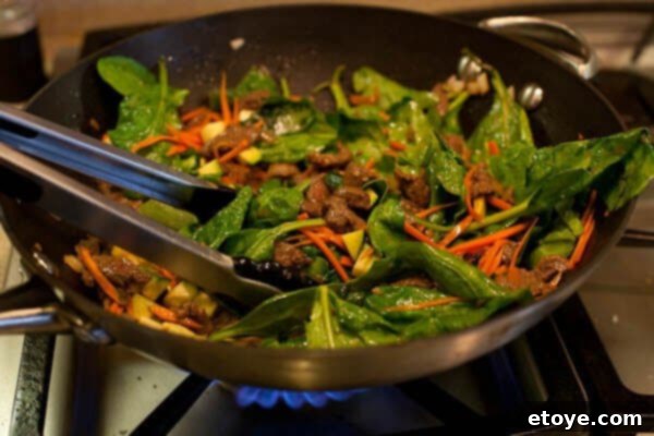 Bulgogi Rice Bowl 12 All ingredients of the stir-fry being tossed together in the wok