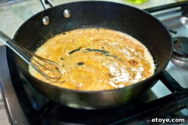 10-Minute Shrimp & Mushroom Thai Curry 7 Whisking coconut milk and curry paste together