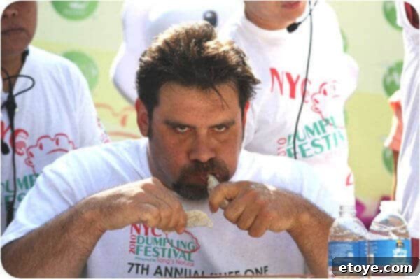 The animated emcee on stage, engaging the audience and offering lively commentary during the dumpling eating contest