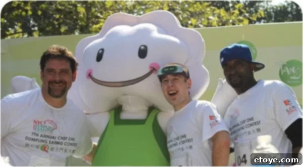 Gentleman Joe Manchetti, the reigning men's champion, beaming with pride after securing his victory in the dumpling eating contest