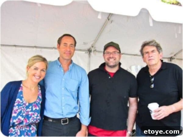 A panel of esteemed judges and event organizers gathered on stage at the Dumpling Festival, including influential figures from the food industry