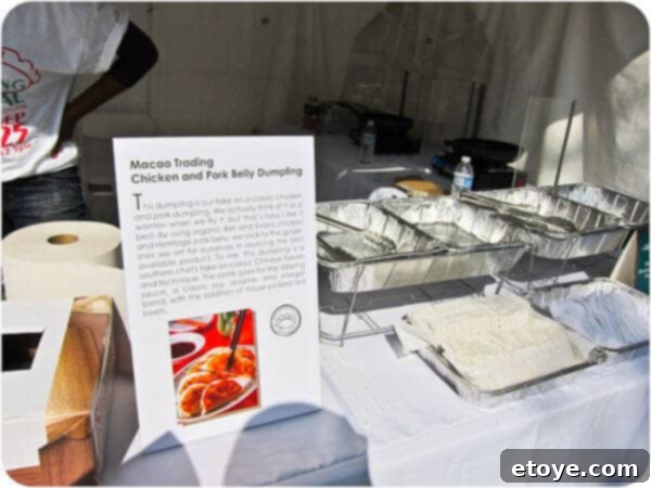 Close-up of freshly prepared, golden-brown chicken and pork belly dumplings, glistening and ready to be savored