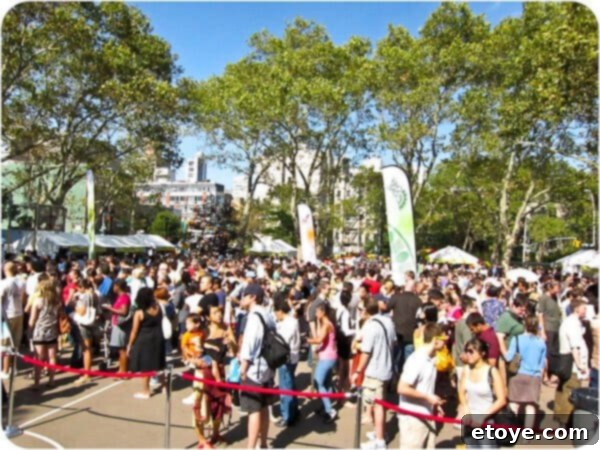 The emcee commanding the stage at the Dumpling Festival, interacting with a vast and enthusiastic audience