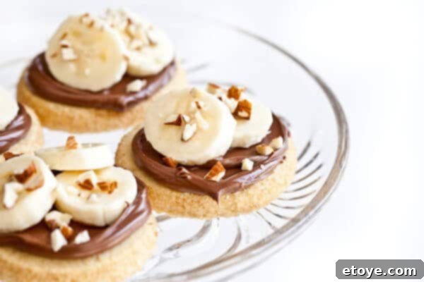 Buttery Shortbread with Nutella Banana Almond Bliss 2 A delicious shortbread cookie with Nutella, banana, and almonds ready to be served.