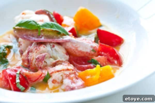 plate with butter poached lobster on it, ready to serve