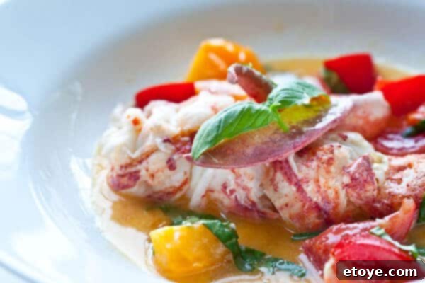 side shot of butter poached lobster, showcasing its richness