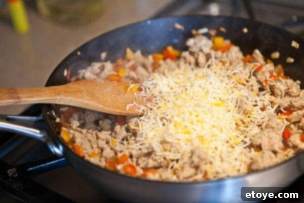 Adding cheese to stuffing