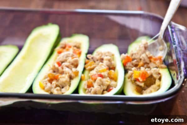 Filling zucchini with stuffing