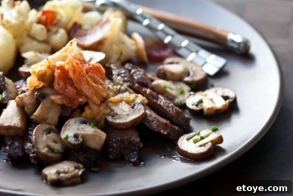 Grilled Skirt Steak with Kimchi Butter served on a platter