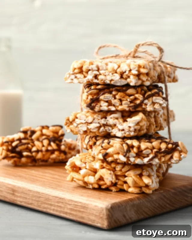 Freshly made Rice Krispie treats wrapped in parchment paper, ready to be enjoyed or shared.