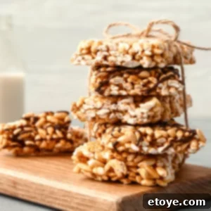 Delicious Rice Krispie treats wrapped in parchment paper.