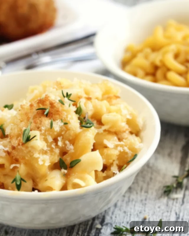 Creamy microwave mac and cheese served in a white bowl, garnished with toasted breadcrumbs and fresh parsley, highlighting its delicious appeal.