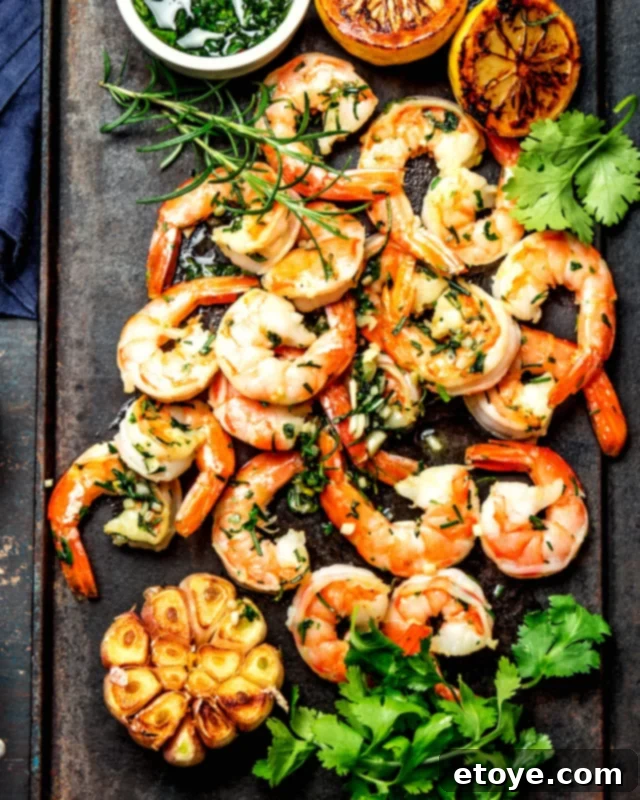 Garlic Shrimp in Minutes 2 Cooked garlic shrimp elegantly arranged on a serving dish, garnished with fresh parsley.