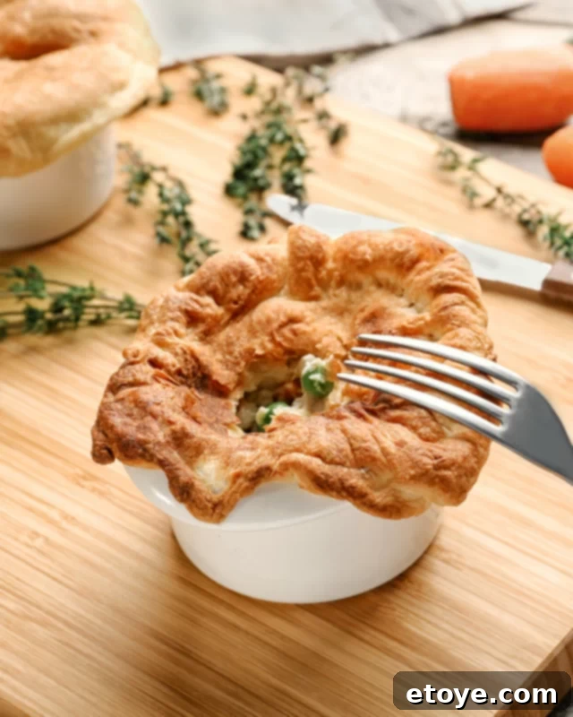 Microwave chicken pot pie on a cutting board, ready to serve.