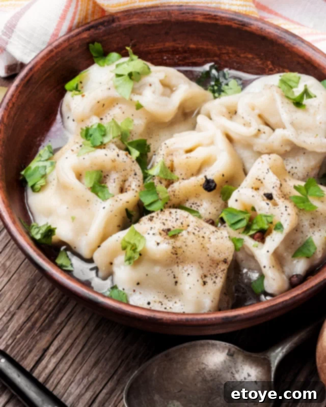Microwave Magic: Quick Ground Beef Dishes 5 ground beef dumplings in a brown bowl with herbs.