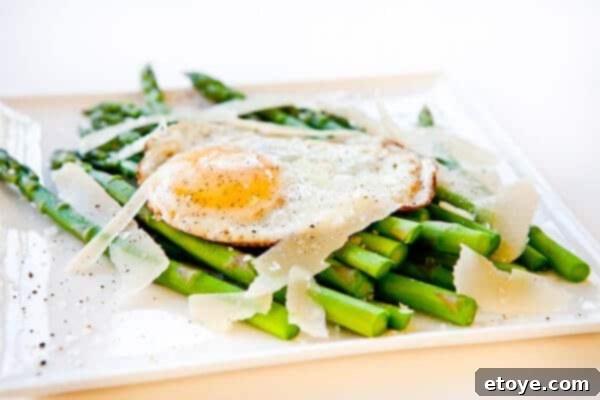 Parmesan Asparagus with Fried Egg 2 Fresh asparagus spears with a perfectly fried egg and grated Parmesan cheese