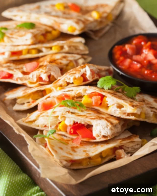 Instant Microwave Quesadillas 2 Tray of quesadillas on a small sheet pan with salsa.