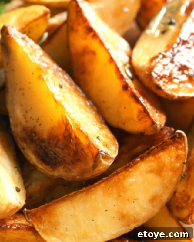 A close-up shot of seasoned microwave potato wedges, showcasing their tender texture and golden-brown edges.