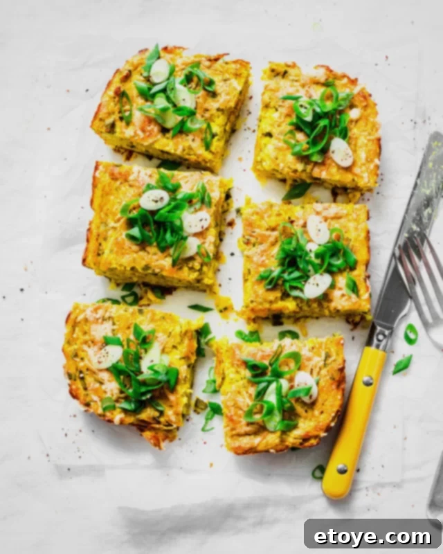 Effortless Microwave Frittata 5 Six appealing slices of frittata garnished with fresh herbs, presented on a white plate, highlighting easy portioning for a healthy meal.