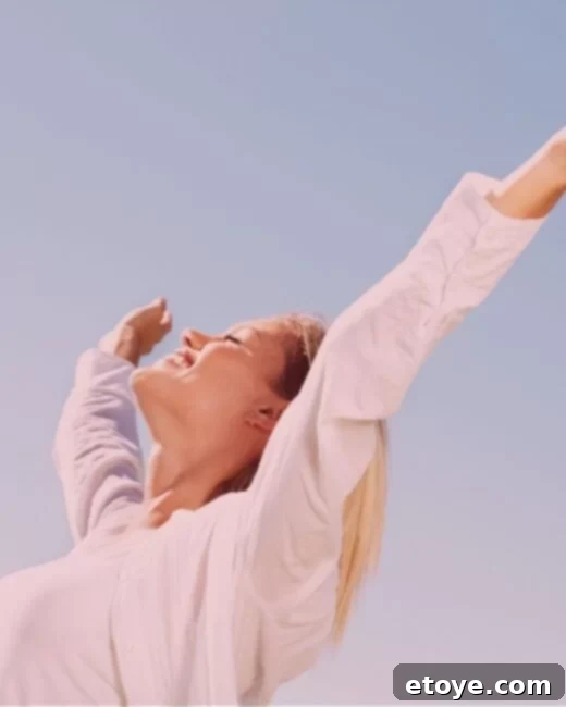 A person's hands gently holding a small plant sprouting from rich soil, symbolizing growth and nurturing