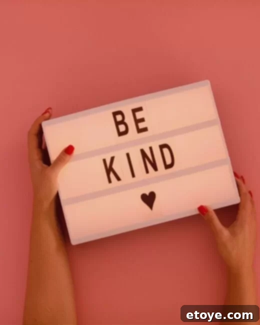 A person's hands reaching up towards a clear blue sky, symbolizing ambition and reaching for higher goals