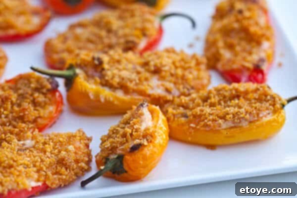 Crispy Baked Jalapeno Bacon Poppers 13 A perfectly baked mini sweet pepper popper, showing the melted cheese and crispy topping.