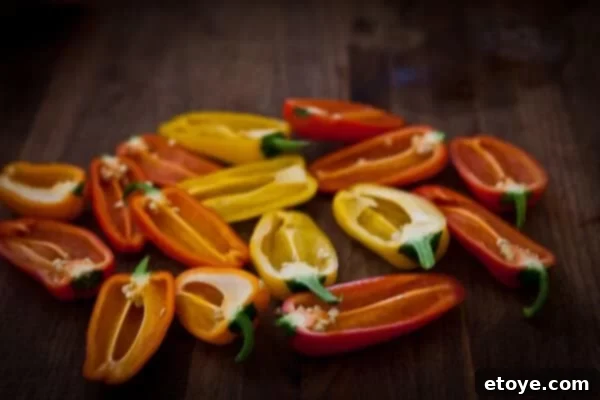 Crispy Baked Jalapeno Bacon Poppers 7 Close-up of a bowl filled with a rich, creamy cheese and bacon mixture, ready for stuffing.