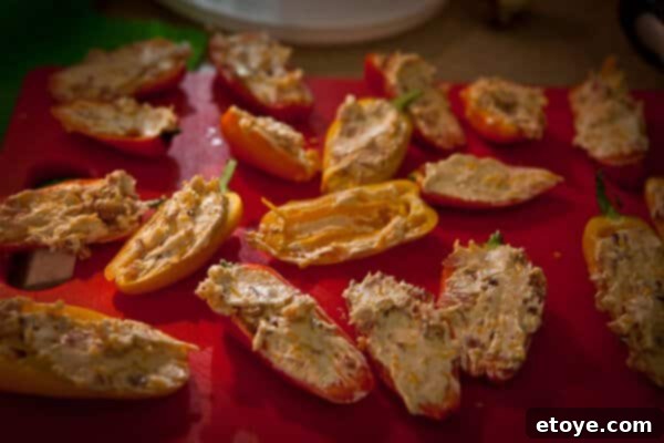 Crispy Baked Jalapeno Bacon Poppers 9 Raw bacon strips sizzling in a pan, cooking to crispy perfection.