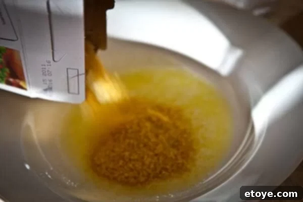 Crispy Baked Jalapeno Bacon Poppers 10 Close-up of sweet mini peppers, some filled with cheese mixture, others coated in corn flake crumbs.