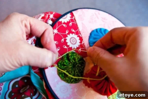 Whip Up Your Own Kitchen Hand Towels 28 Re-entering Fabric for French Knot