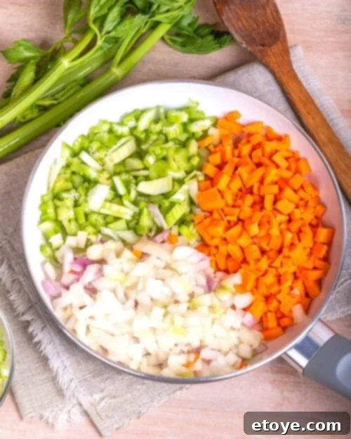 Mirepoix of celery, carrots, and onions in a satué pan. 