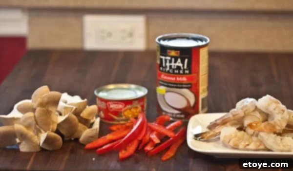 Lightning-Fast Thai Shrimp Curry 2 Assortment of fresh ingredients for Thai Shrimp Curry, including mushrooms, curry paste, and coconut milk