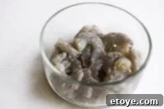 Marinating shrimp for Shrimp and Zucchini Stir Fry and Crispy Basil