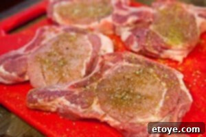 Pork chops seasoned with ginger, cumin, salt, and pepper