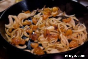 Caramelizing apricots in the pan with onions