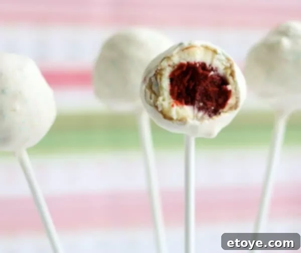 Close-up of a Red Velvet Cheesecake Pop showing its layers