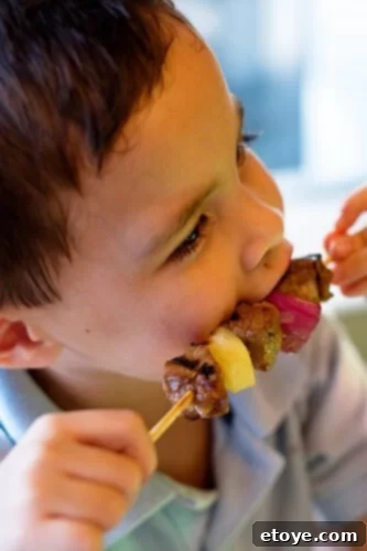 Martha Stewart Guest Writer's Thai Curry Beef Skewers 4 A happy Andrew enjoying a delicious Thai Curry Beef Skewer