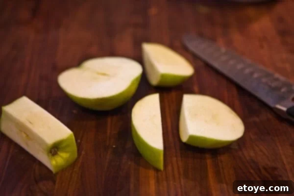 Chicken Sausage & Apple Slaw 7 Segmenting an apple for slaw, carefully cutting around the core